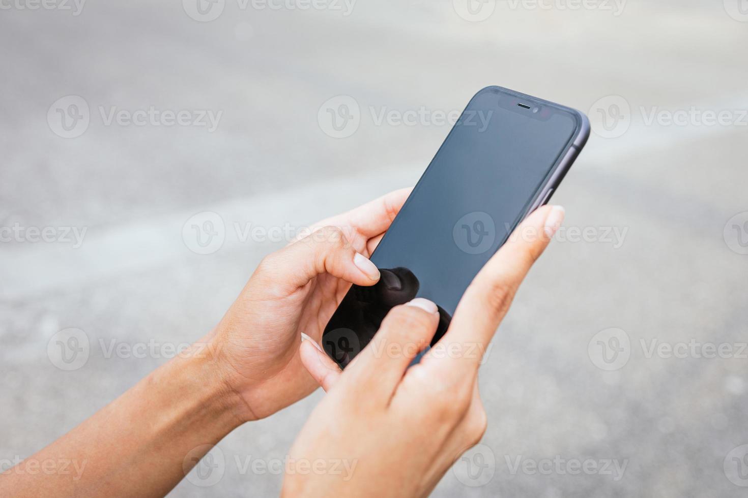 A girl's hands talking on a smartphone. photo