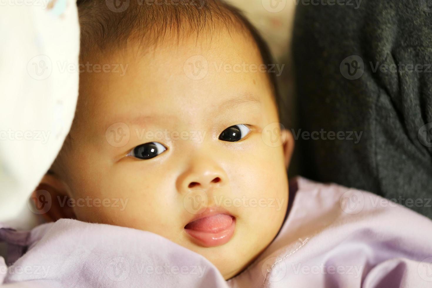 Sick asian baby in a hospital. Child got fever and admit in hospital. photo