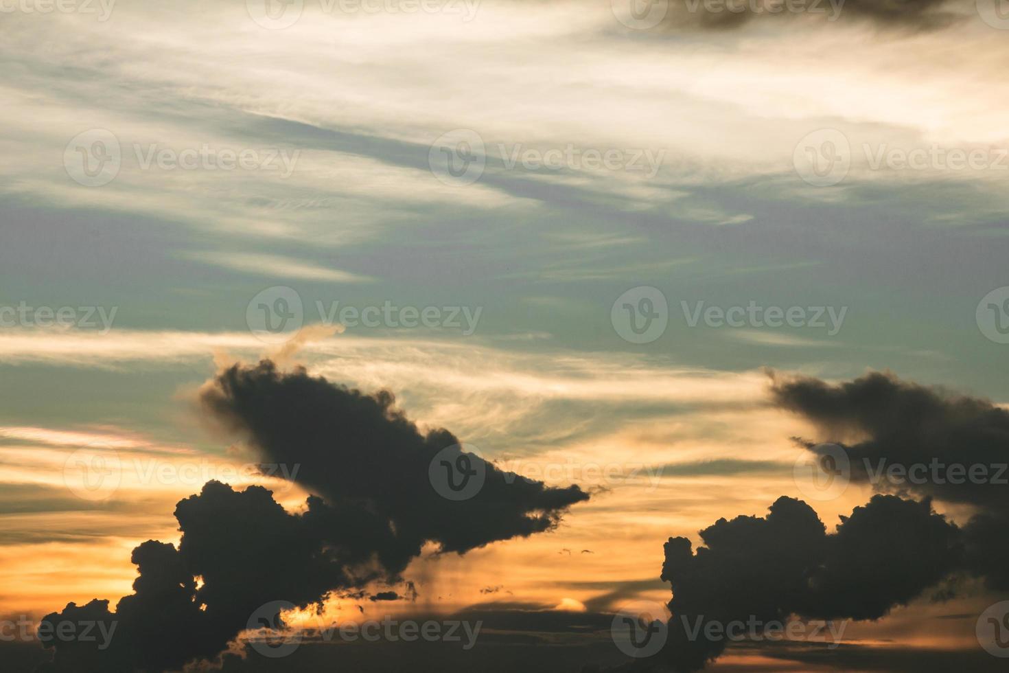Dark clouds and orange sky photo