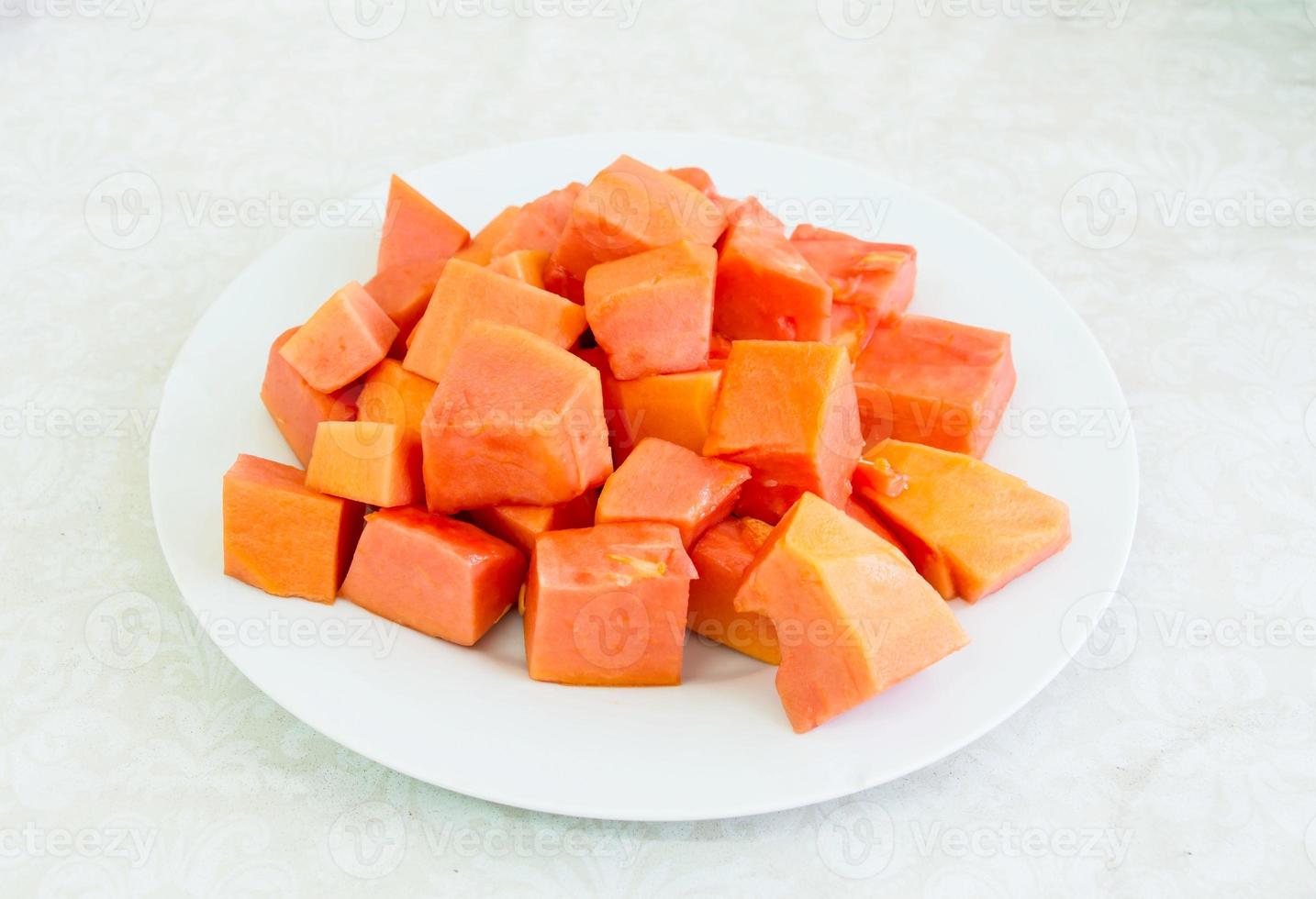 Papaya on white plate photo
