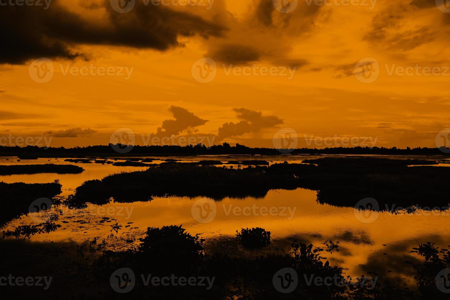 Dark clouds and orange sky photo
