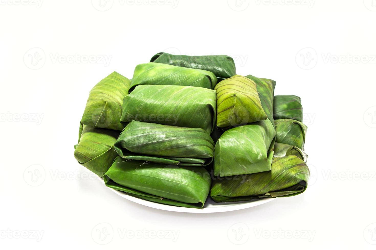 Glutinous rice steamed in banana leaf photo