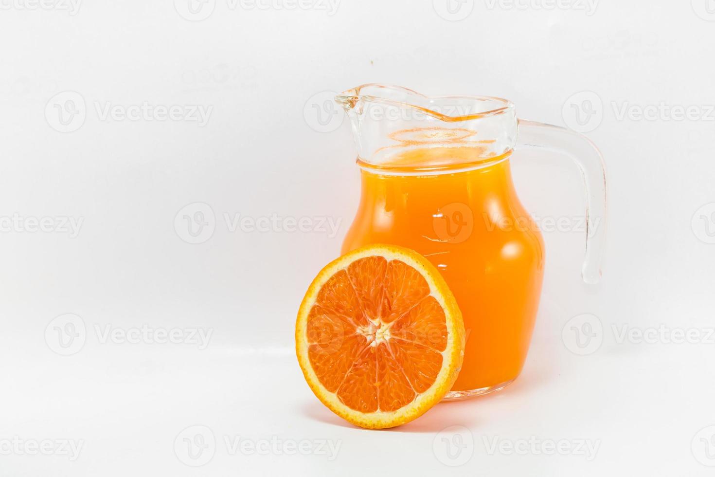 Orange juice and slices of orange isolated on white photo