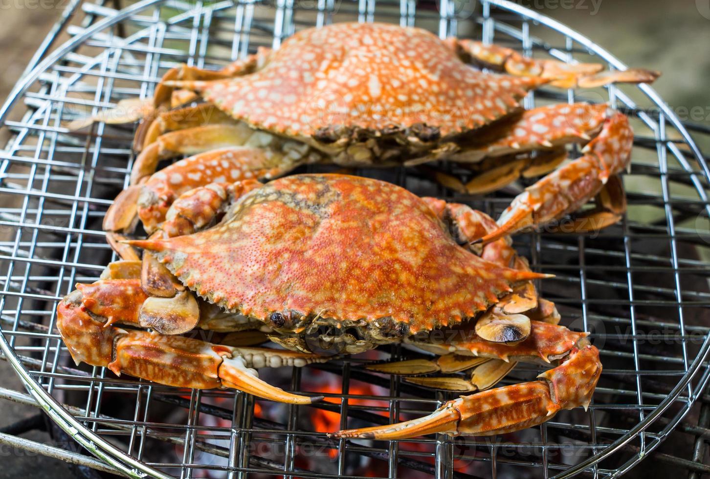 crabs shrimps on charcoal grill photo