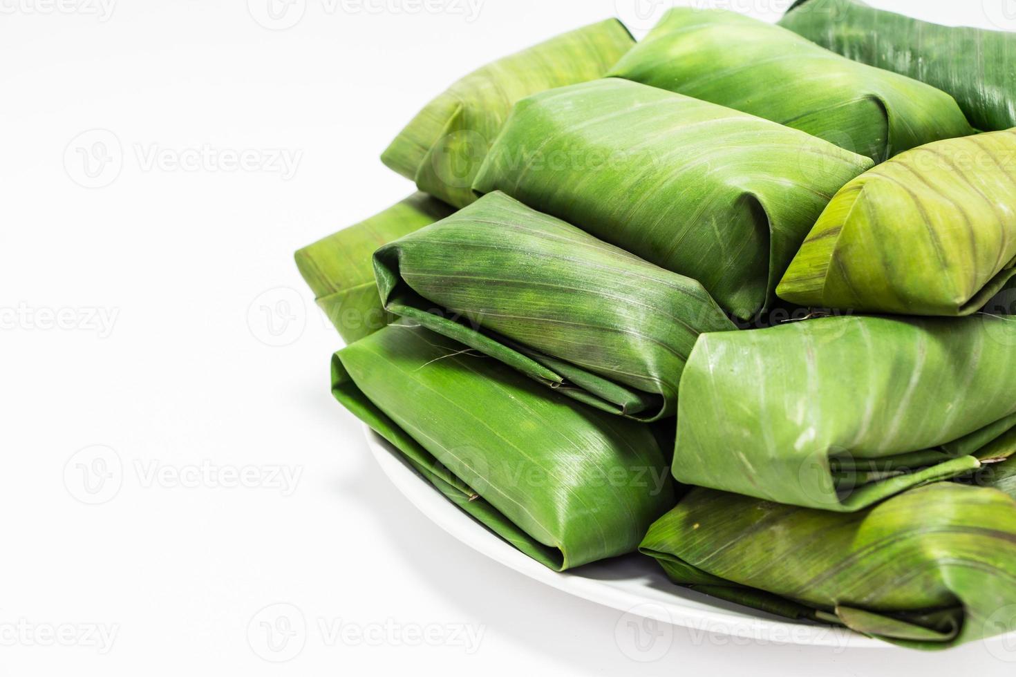 Glutinous rice steamed in banana leaf photo