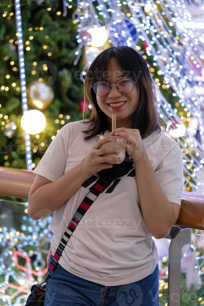 woman holding boba milk tea photo