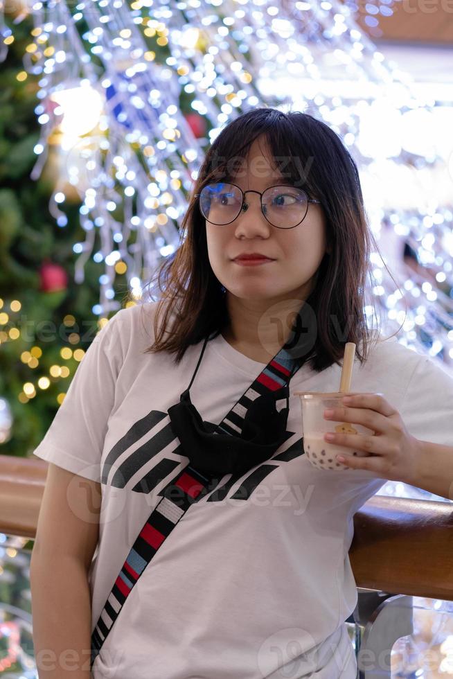 woman holding boba milk tea photo