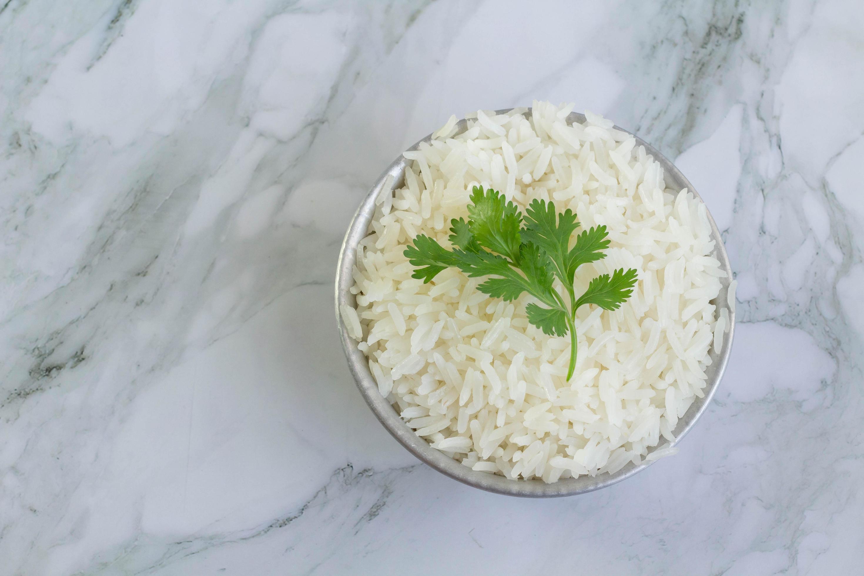cooked white rice Jasmine rice served in a cup 8030168 Stock Photo at Vecteezy