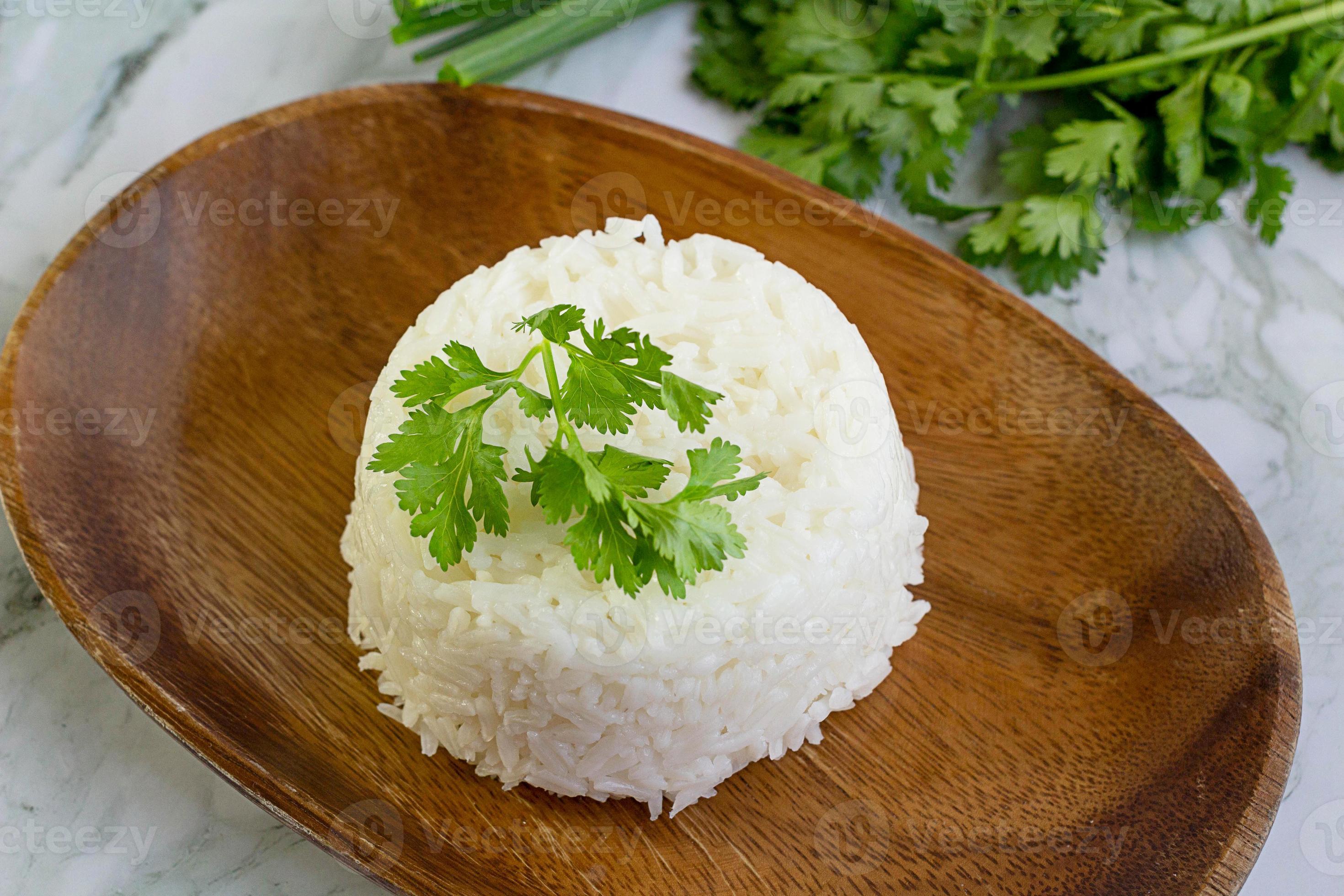 Cooked plain white rice served in a wooden plate 8030180 Stock Photo at