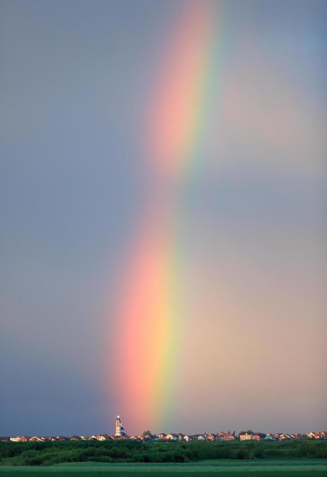 Rainbow above village in Serbia photo