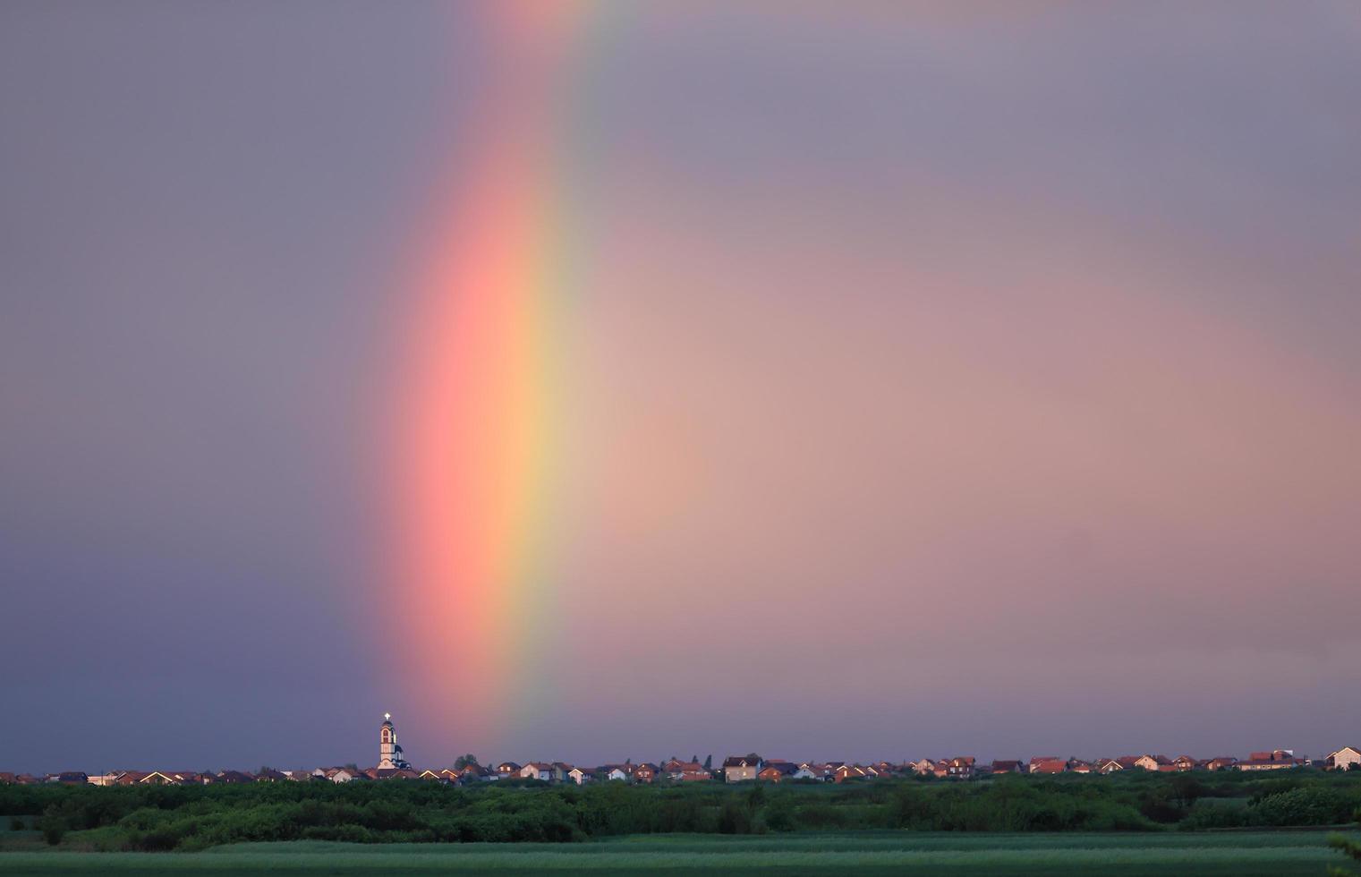 Rainbow above village in Serbia photo