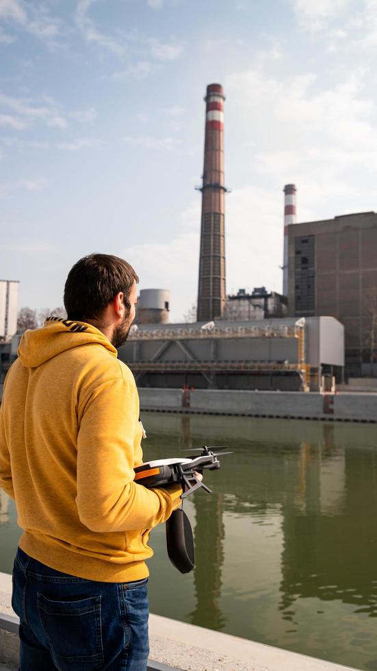 Videographer holding drone photo