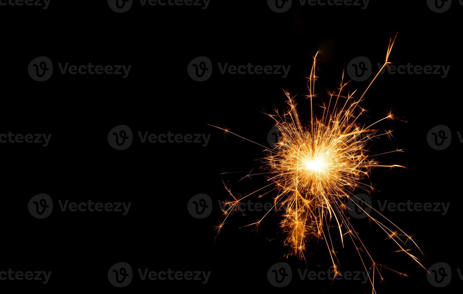 New year party sparkler on black background photo