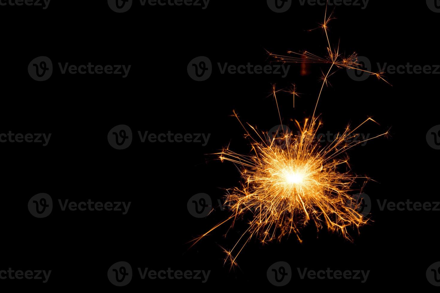 New year party sparkler on black background photo