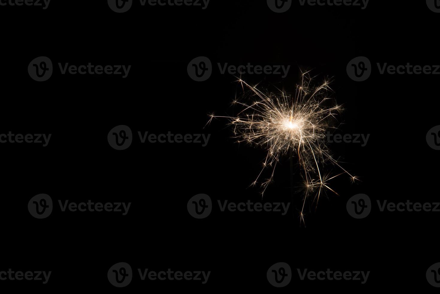 New year party sparkler on black background photo