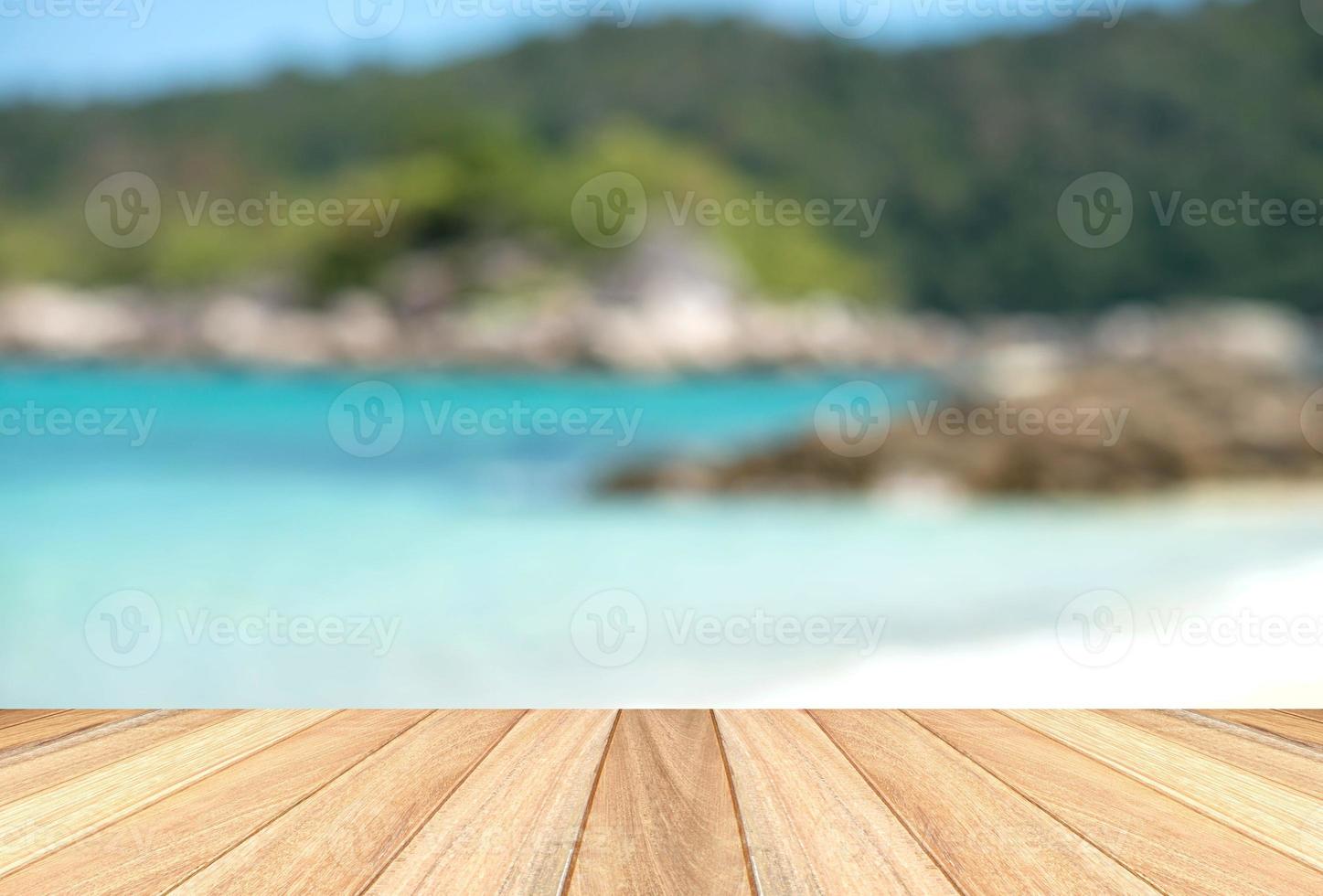 Wooden paving with blur beach background photo