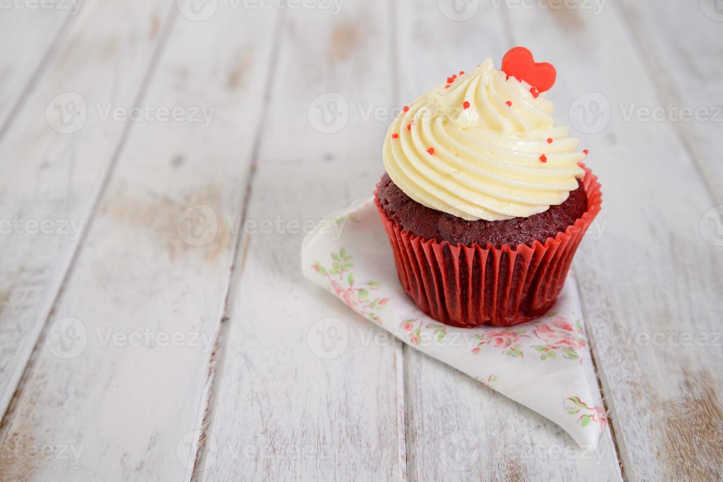 red velvet cupcakes with red heart on top photo