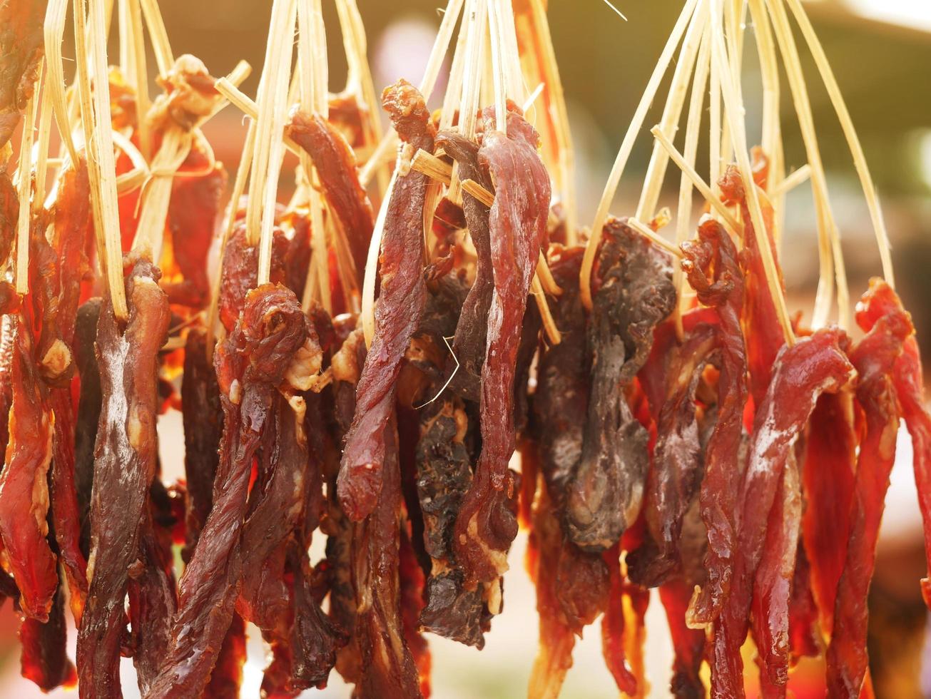 The dried beef is laid out in a row to spread. photo