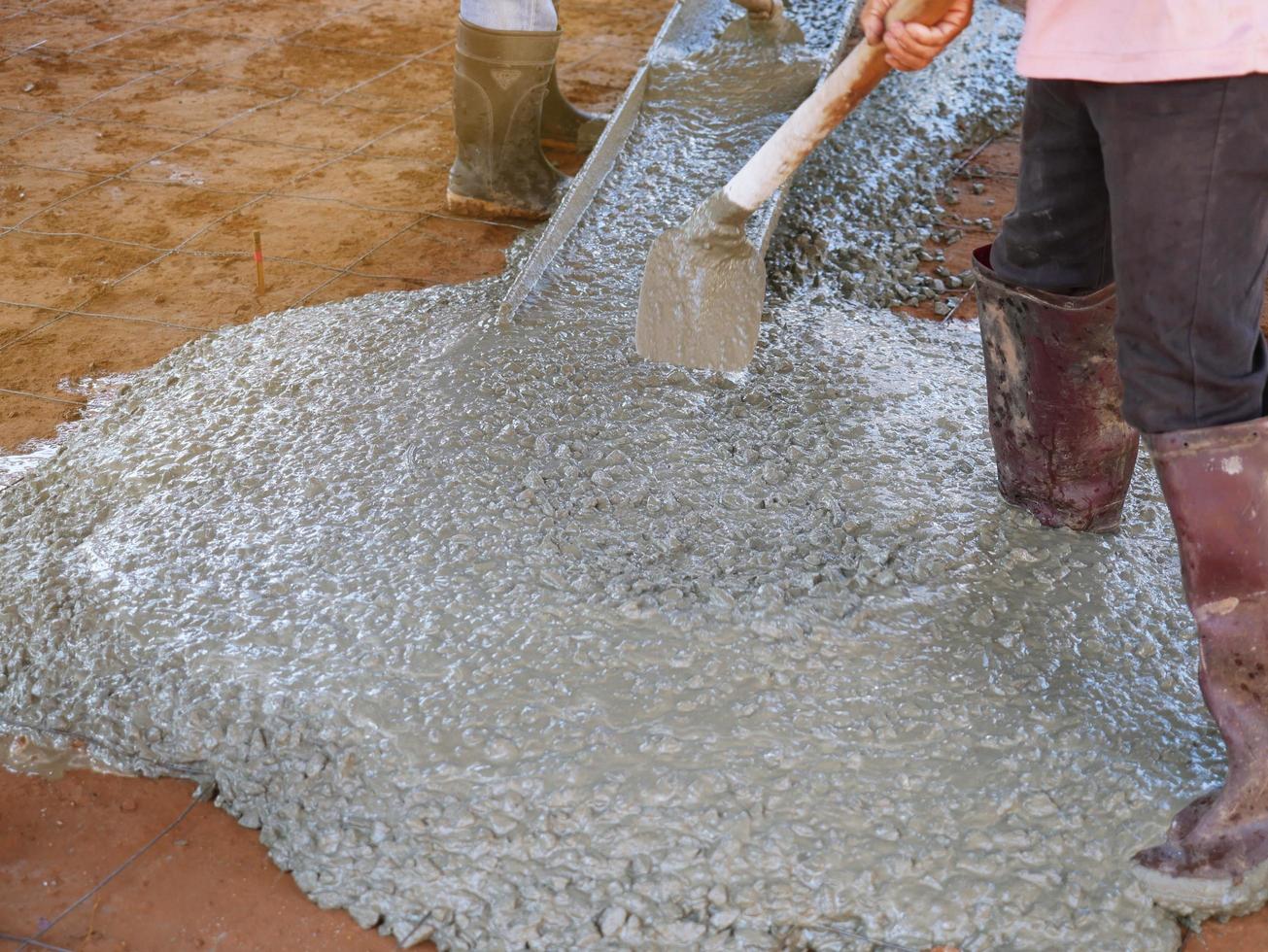 Pour the finished cement in a medium area. photo