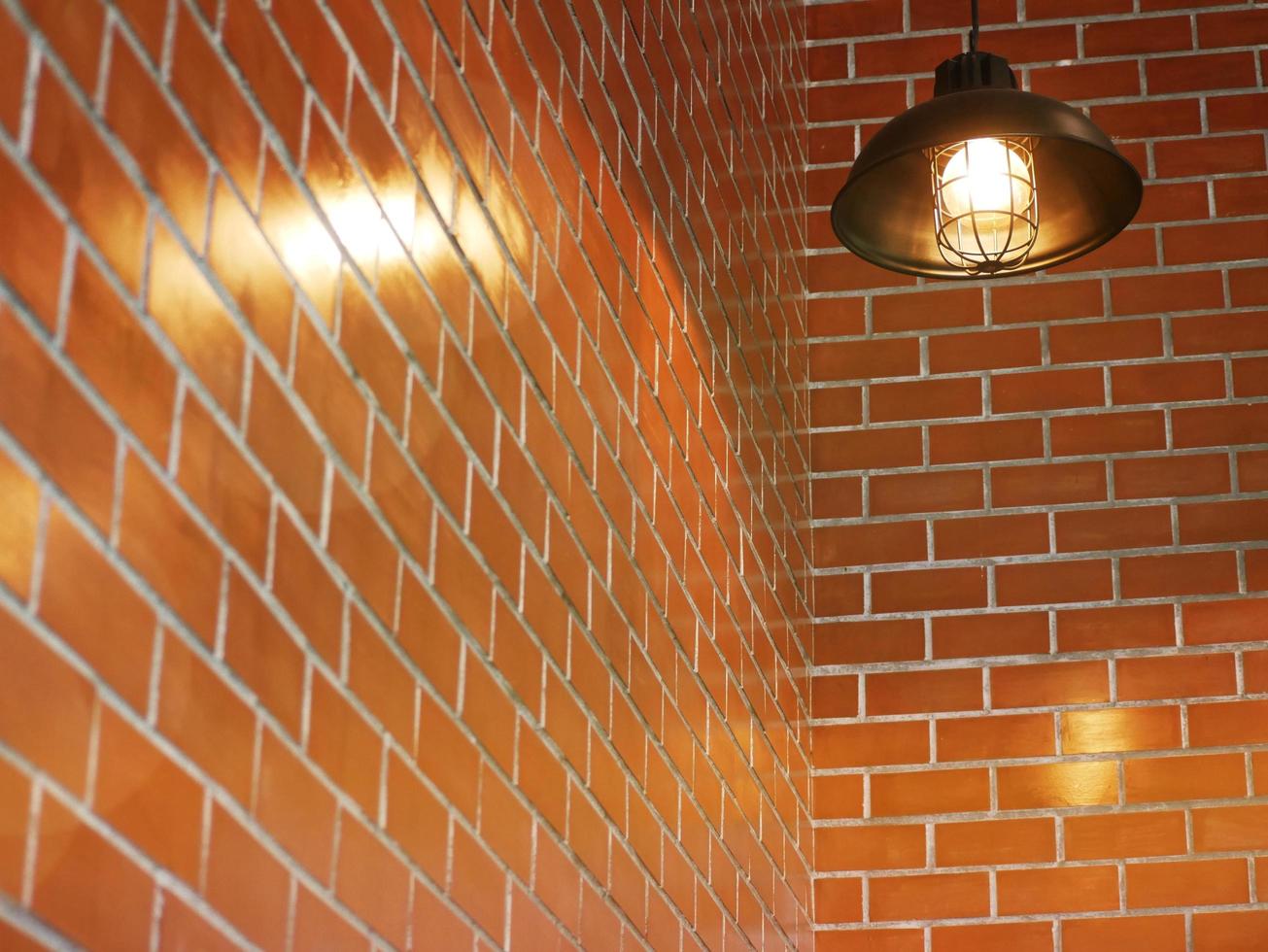 The lamp is hanging on the wall of the cafe. photo