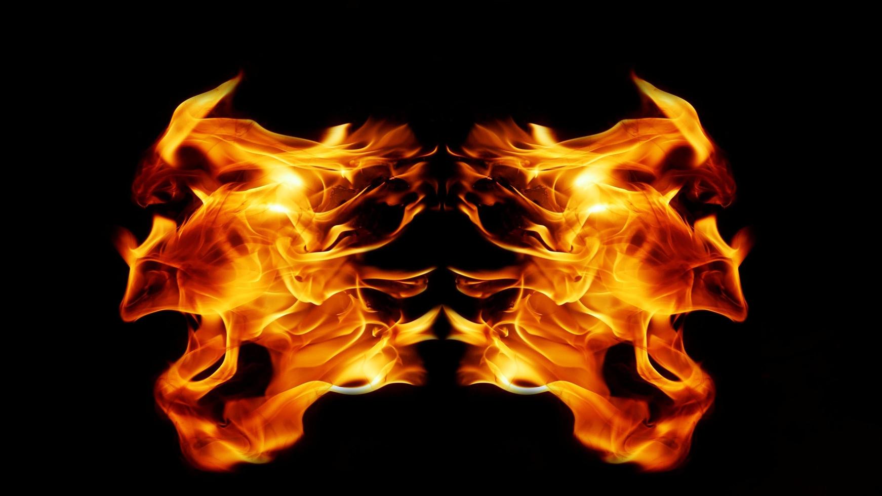 Flame Flame Texture For Strange Shape Fire Background Flame meat that is burned from the stove or from cooking. danger feeling abstract black background Suitable for banners or advertisements. photo