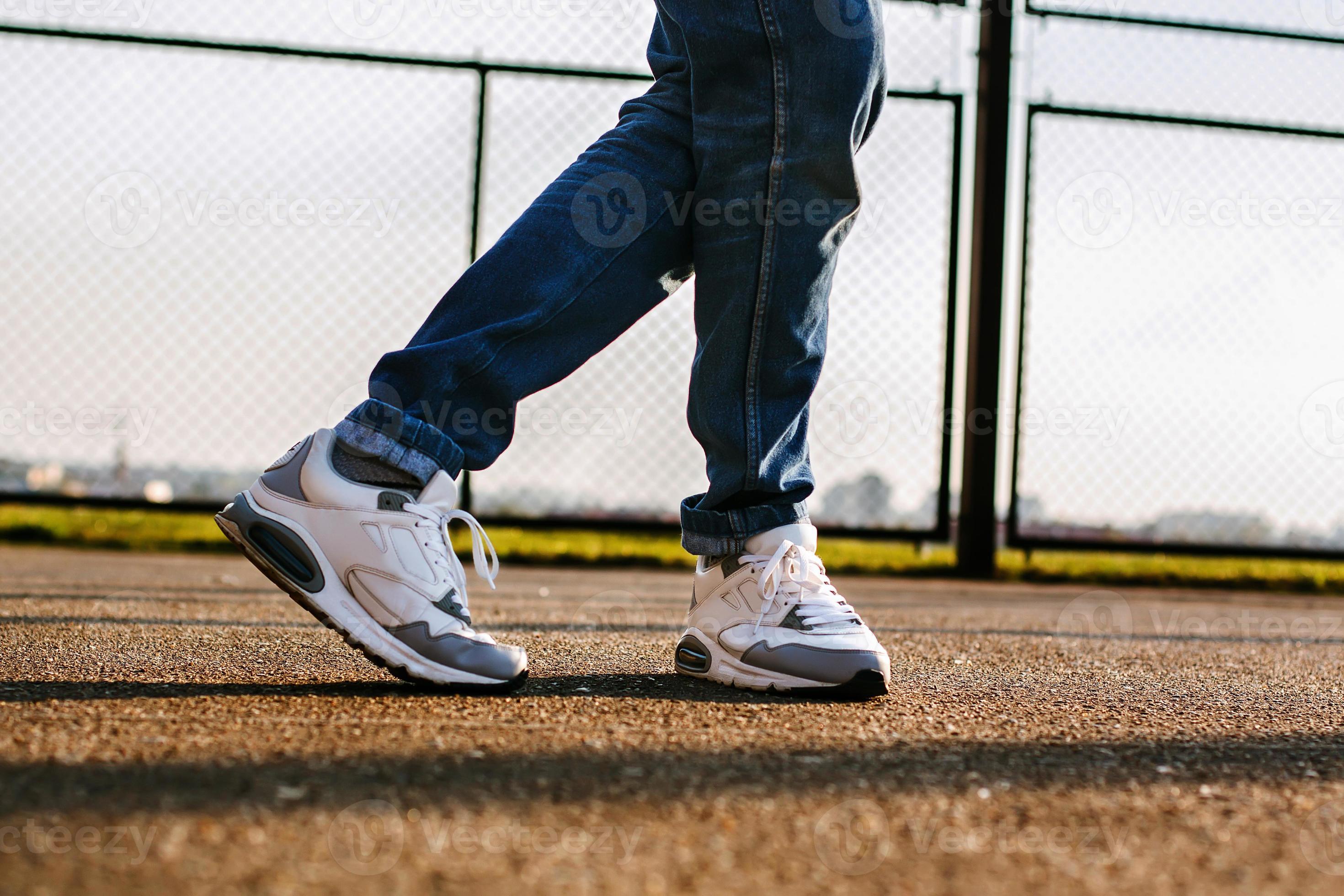 Man with sneakers dancing outside in the stadium at sunset 8034137 Stock Photo at Vecteezy