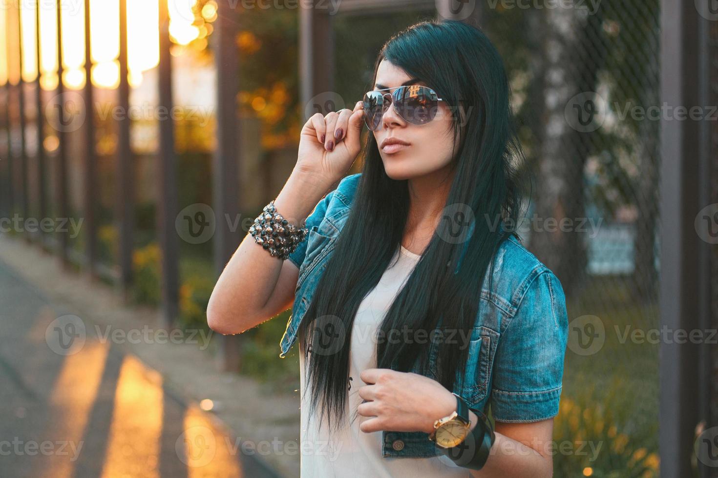 Girl in sunglasses. sun rays sunset photo