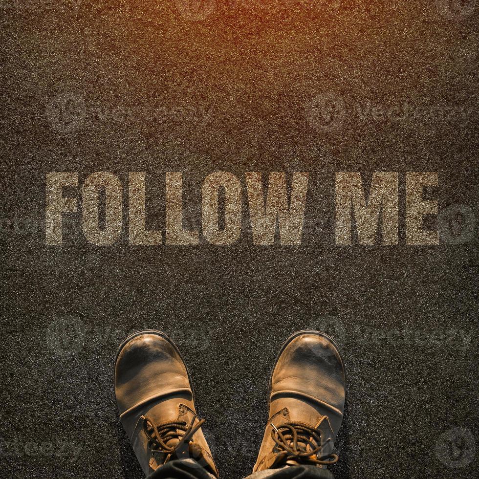 Top View of Follow Me Request Concept for Social Networking on Internet with Hipster in leather boots from Above. photo