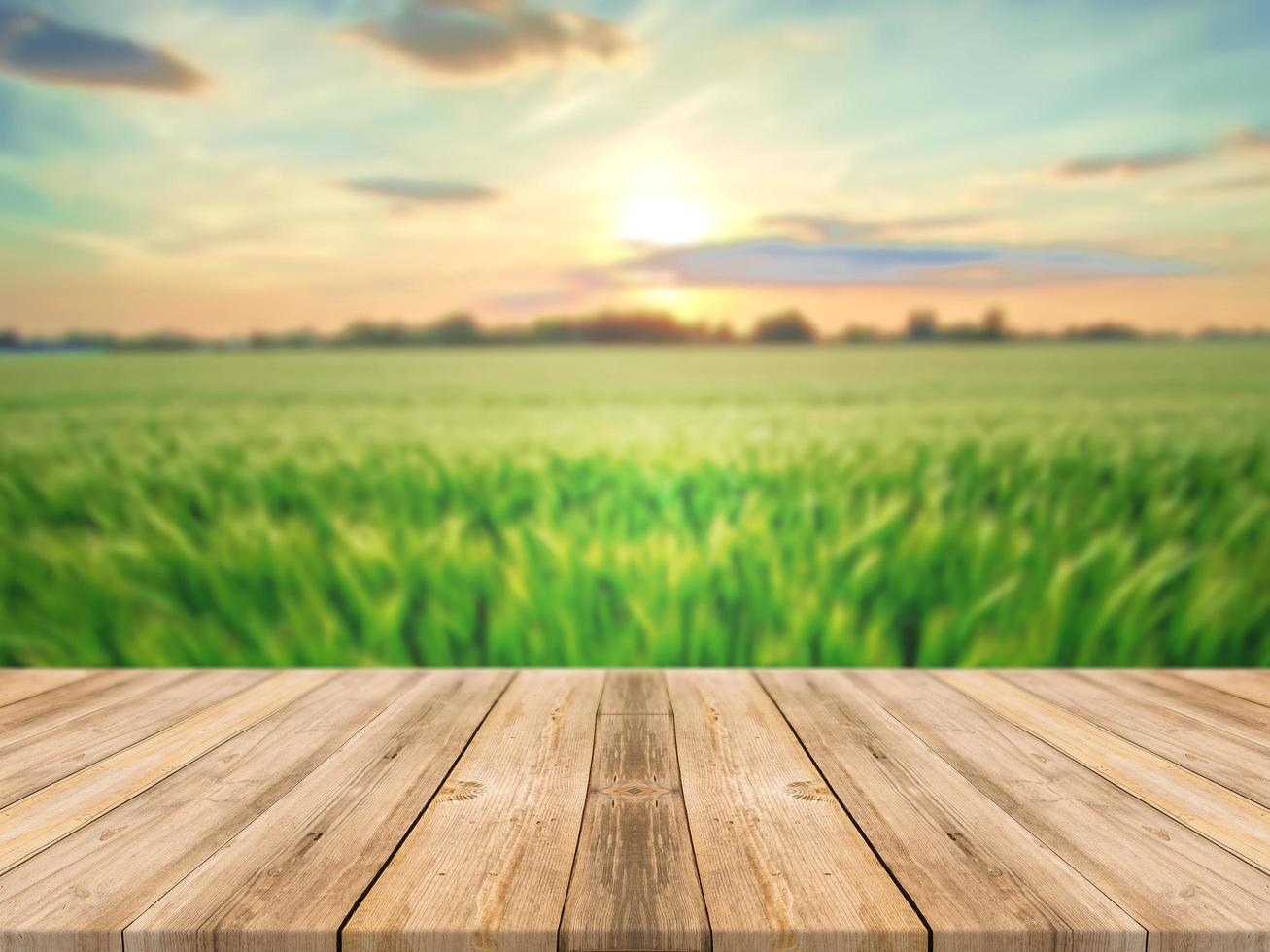 Wooden board empty table and blurred field background 8034910 Stock Photo  at Vecteezy
