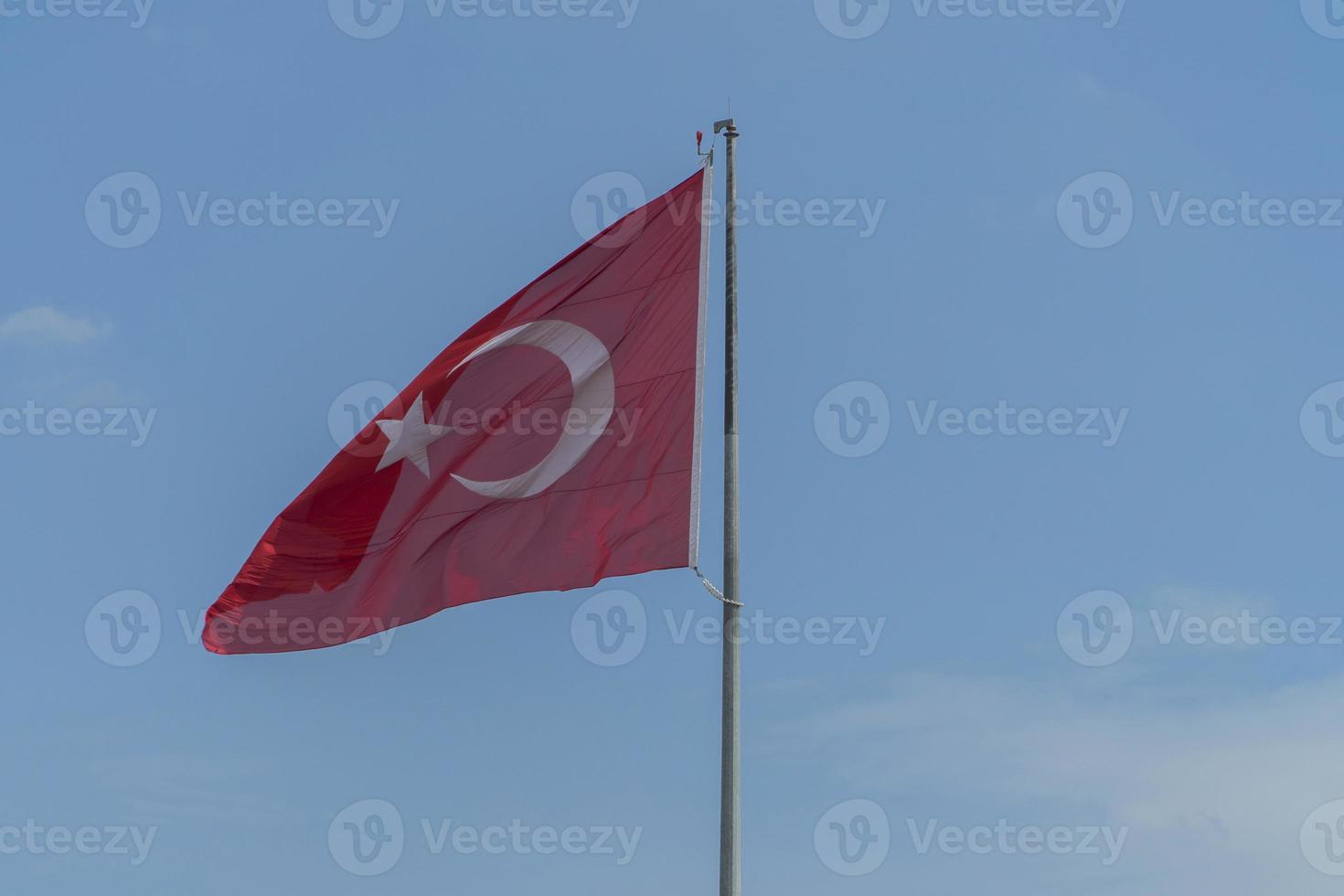 Turkish flag in blue sky background photo