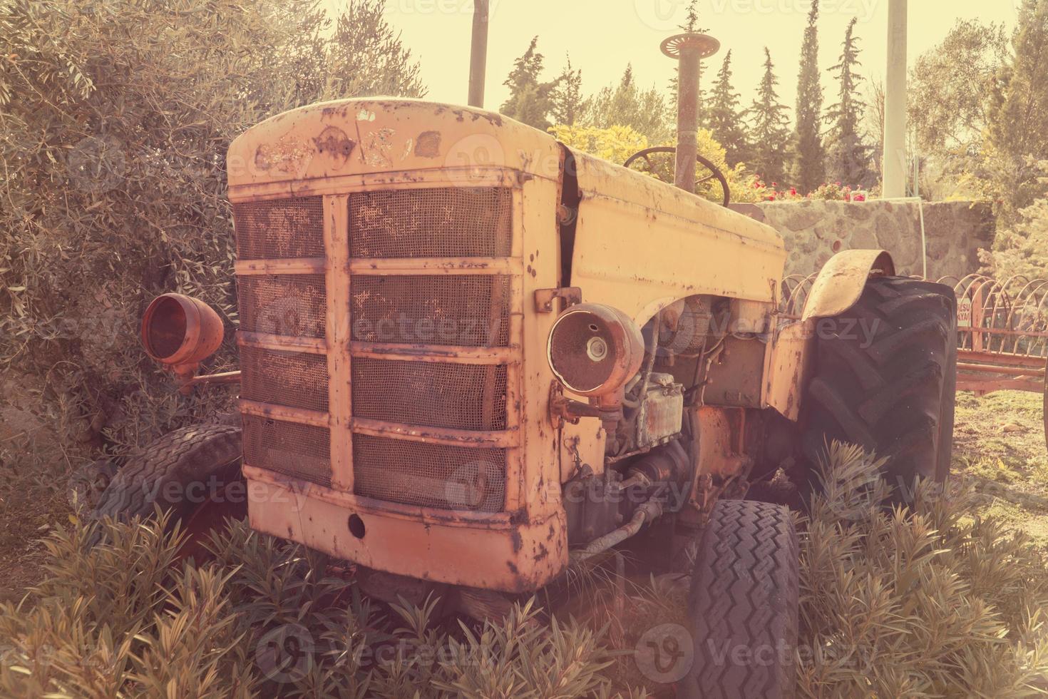old vintage tractor on the farm photo