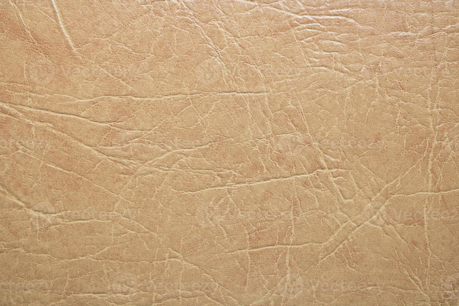 Light cream leather background. brown texture photo