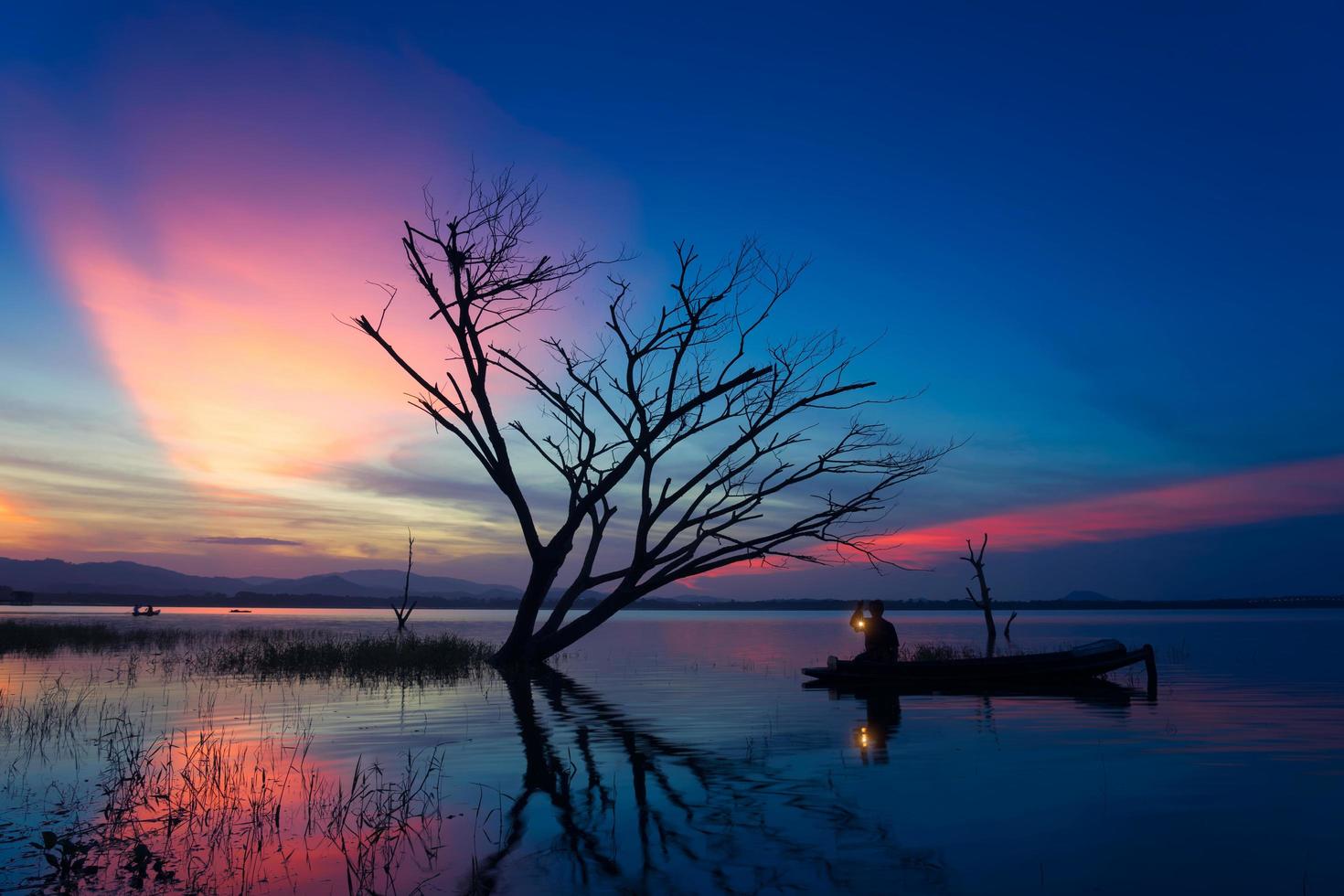 Fisherman of Bangpra Lake in action when fishing, Thailand. photo