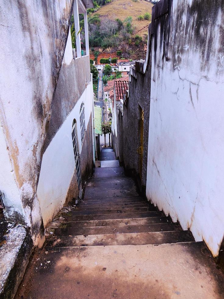 empty concrete outdoor rustic staircase in village of rustic houses photo