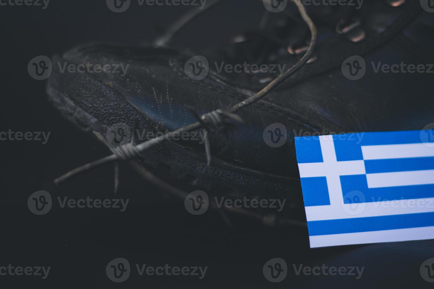 Greece army, military boots flag Greece and Barbed Wire, military concept photo