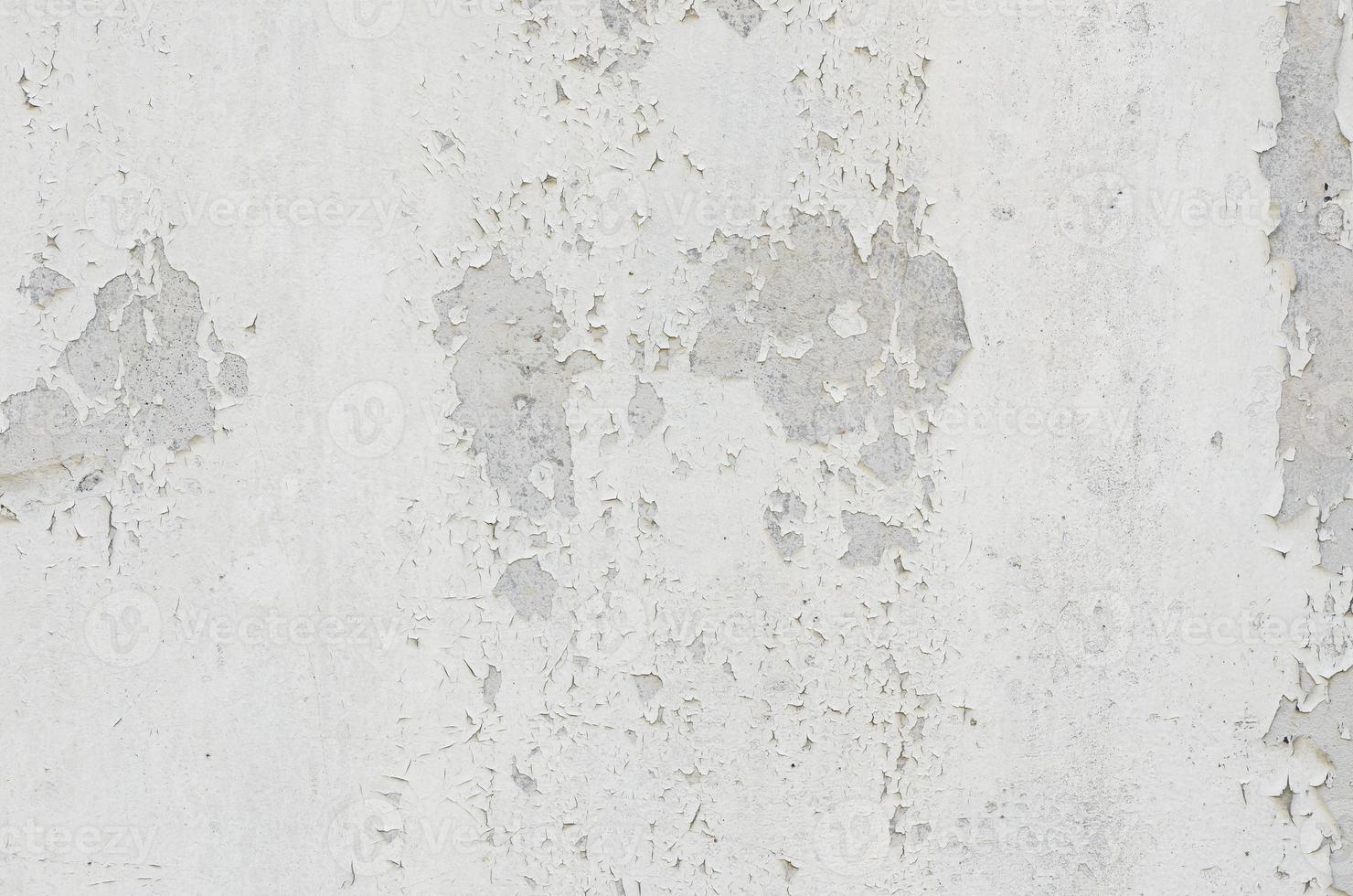 white white background and texture of peeling paint on plaster wall because  old paint expired. photo