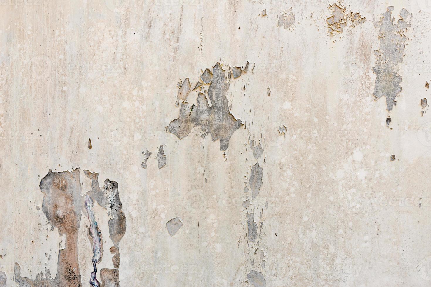 white white background and texture of peeling paint on plaster wall because  old paint expired. photo