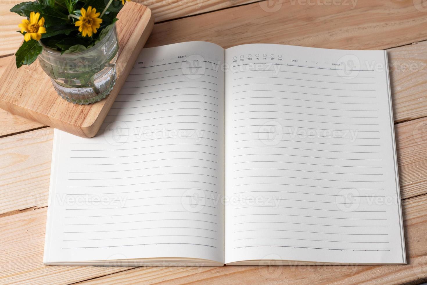 Note book on a wooden background. Copy space photo