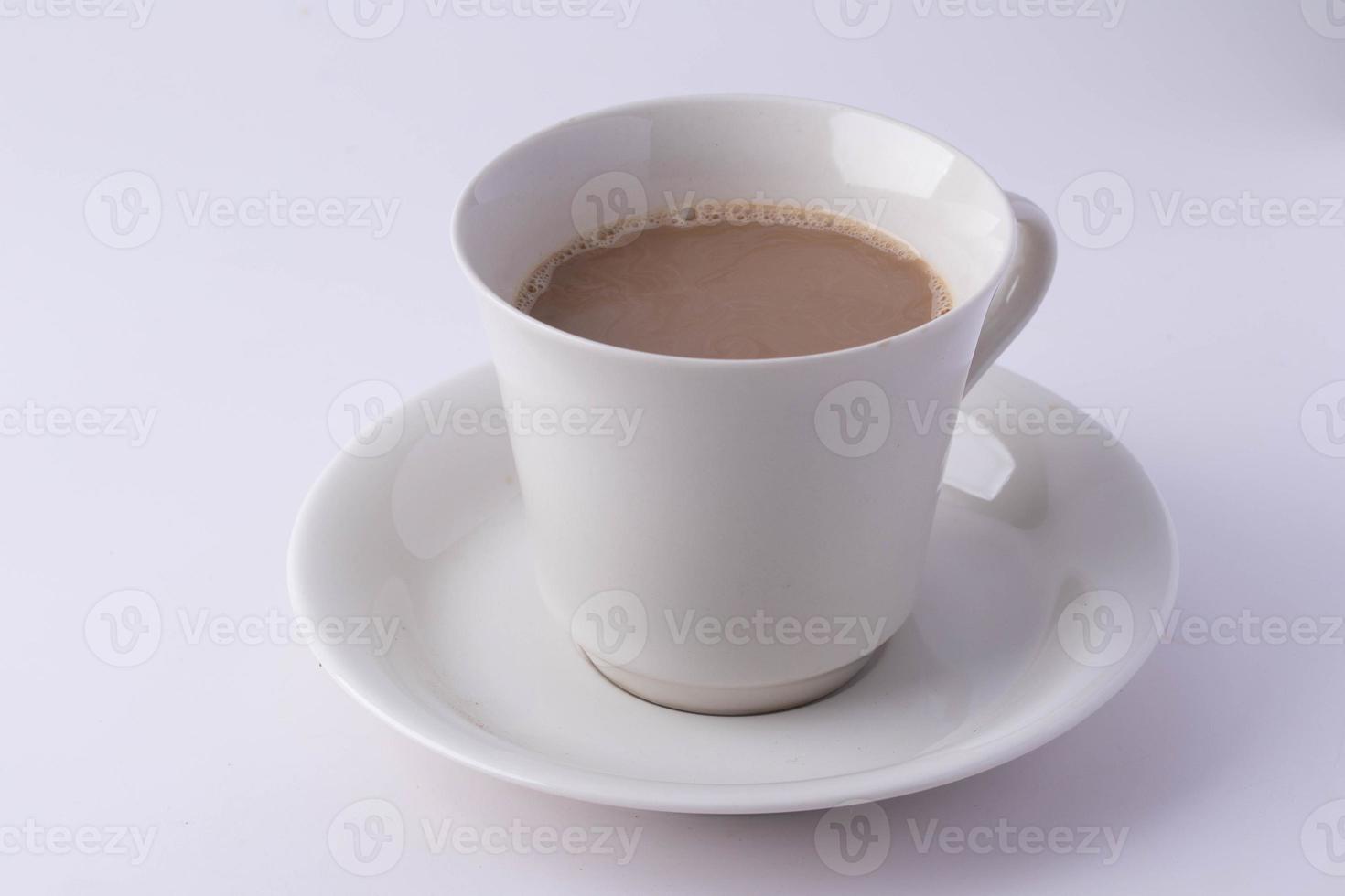 Coffee in a white mug on a white background. Copy space. photo