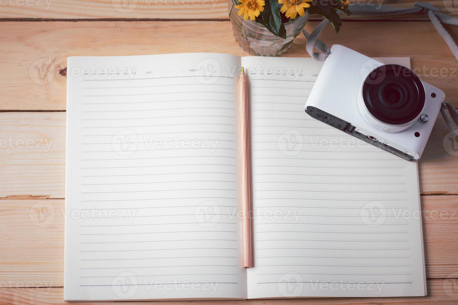 Note book on a wooden background. Copy space photo