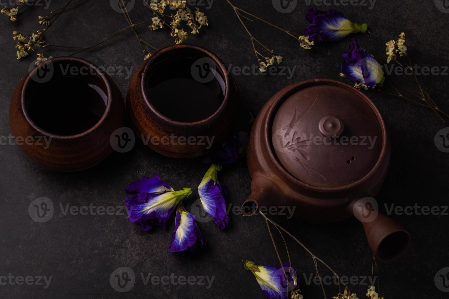 Antique brown chinese tea set on black background photo