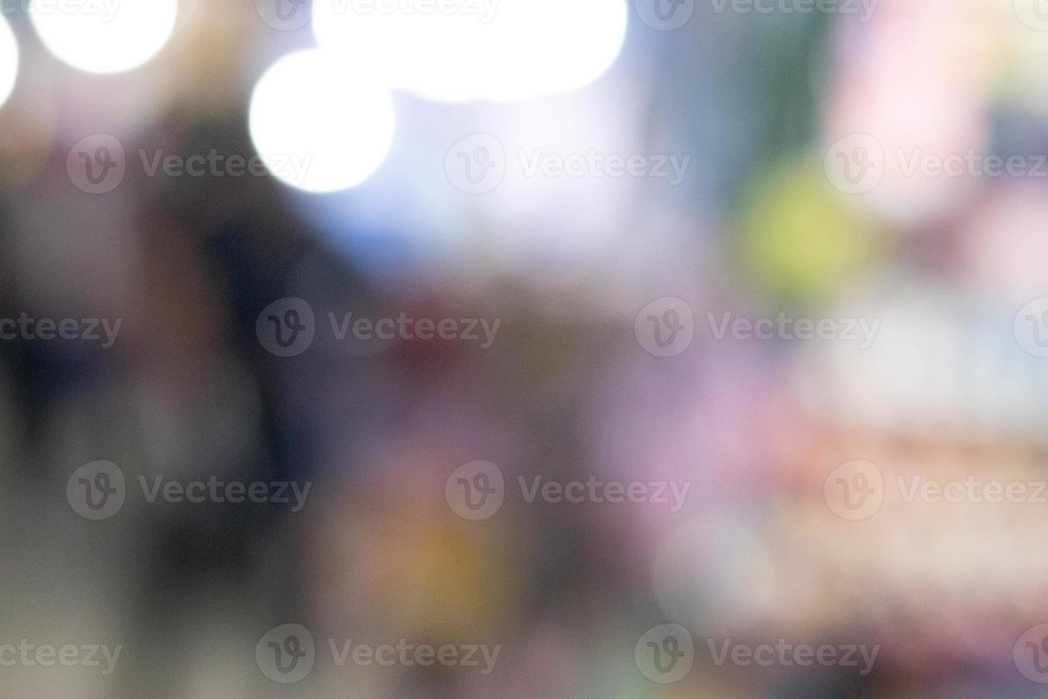 Blurred light with bokeh background of temple fair in Thailand.Abstract blurred circular bokeh background. photo