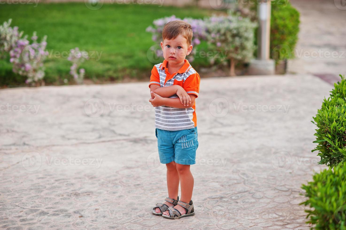 Funny boy at garden of egyptian resort. photo