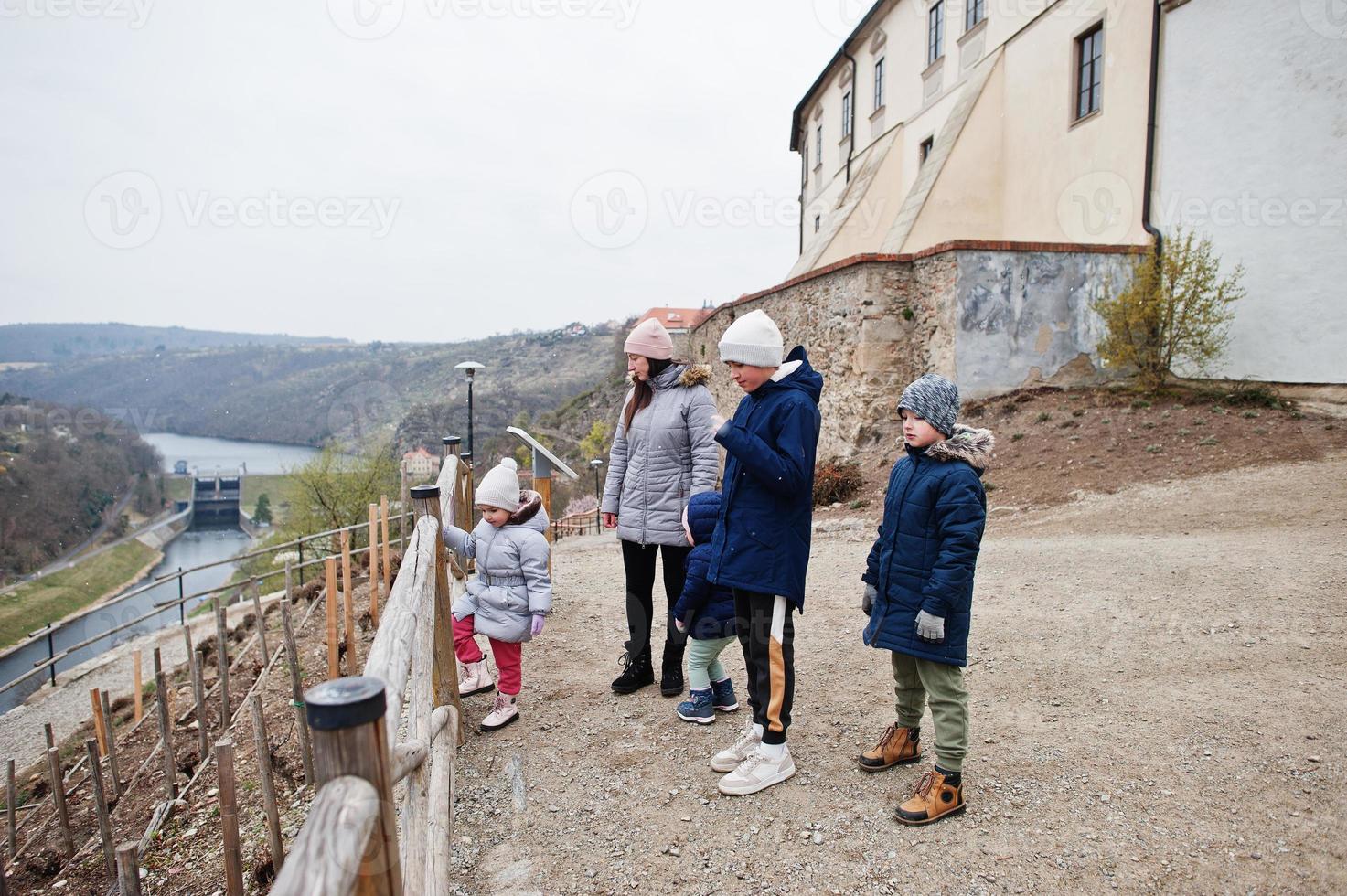 Mother with kids walking at Znojmo castle in Czech Republic photo