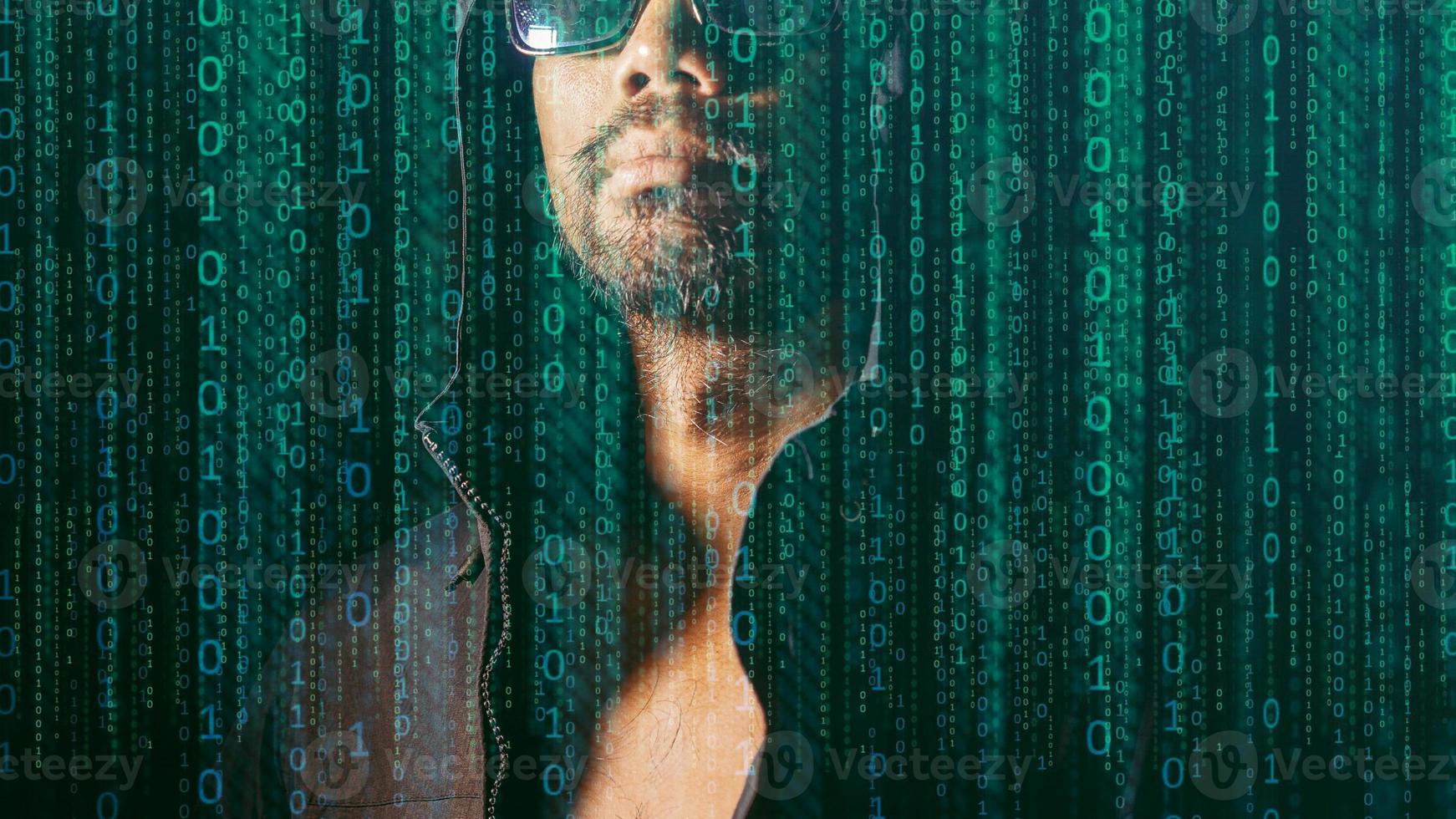 The concept of hackers and insecurity in networking. Dishonest hood man or data thieves photo