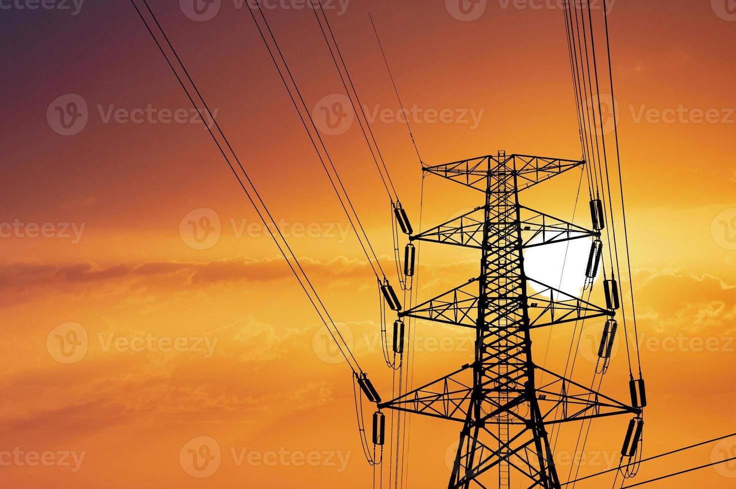 Silhouette of large high voltage transmission towers with clipping path photo