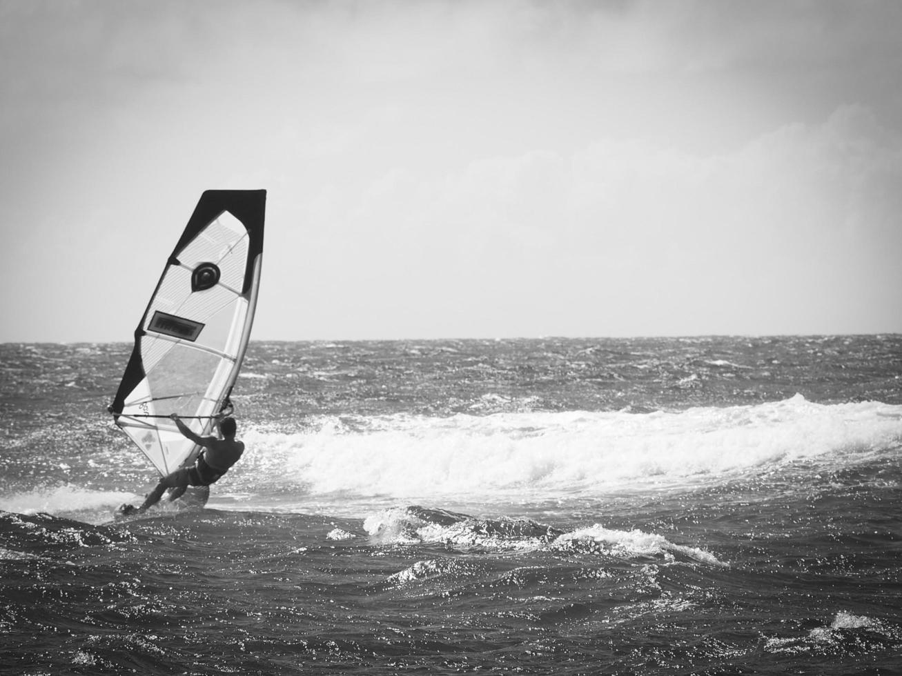 Yellow Windsurf Sail White Water Surfing on Pacific Ocean photo