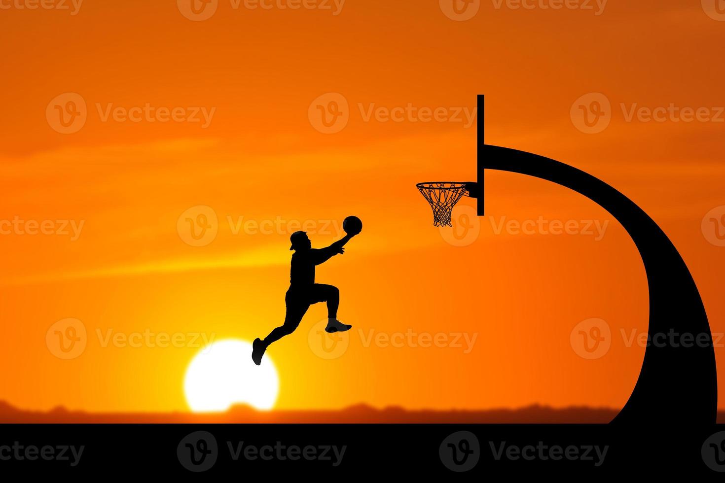 basketball player silhouette jumping photo