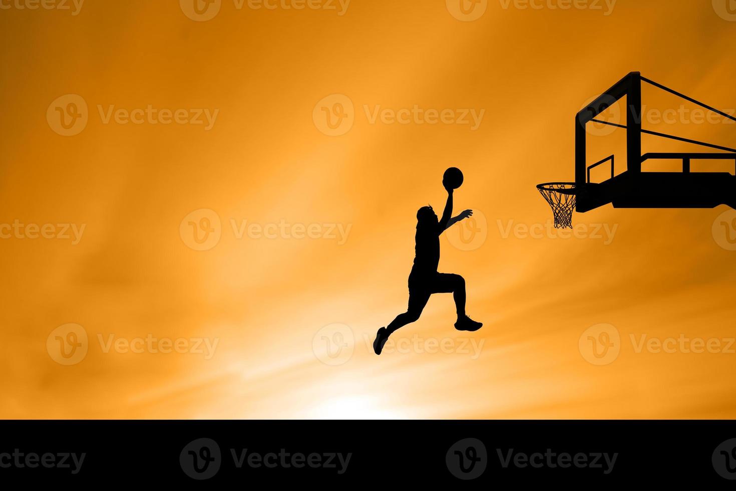 basketball player silhouette jumping photo