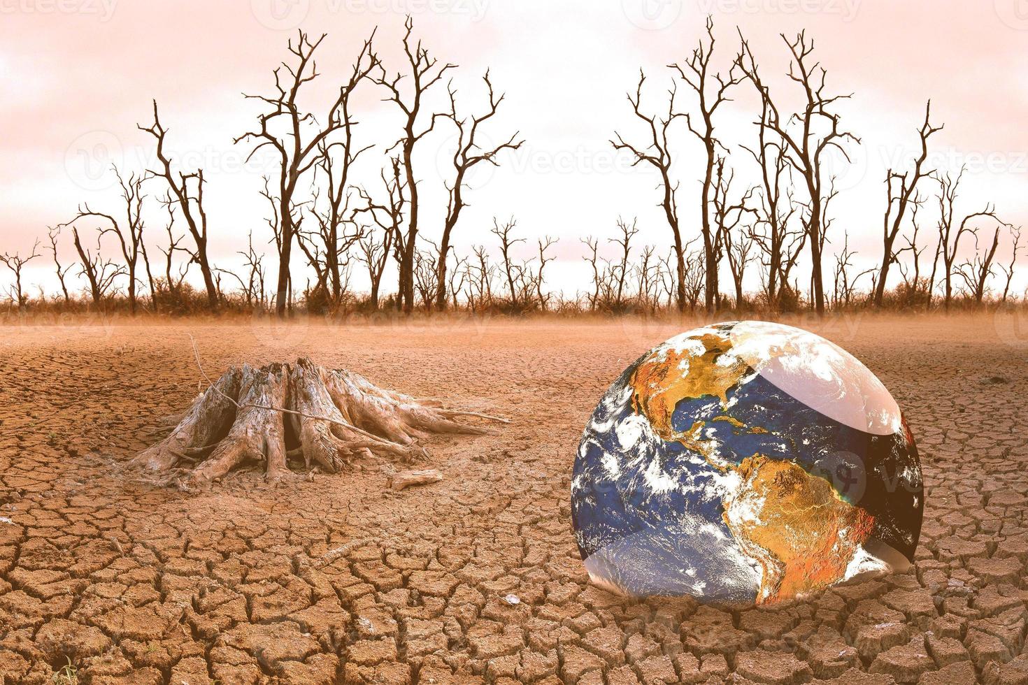 The concept of global warming and drought and poverty and food shortages. Arid soils with hot climates have a globe that lacks green space. photo